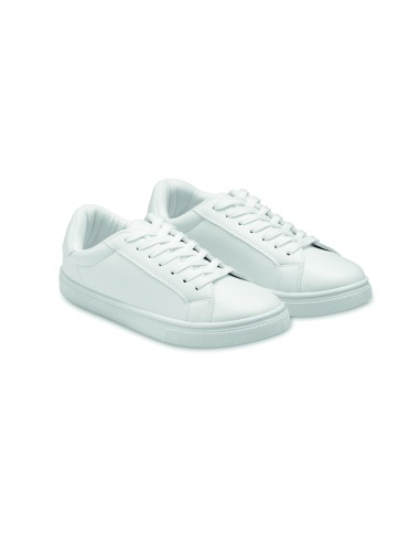 Zapatilla blanca lisa de PU disponible en varias tallas de adulto